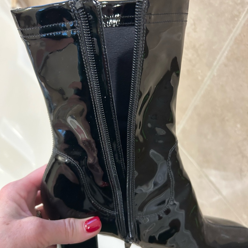 Worn once - 3 1/2 inch heel patent boot.